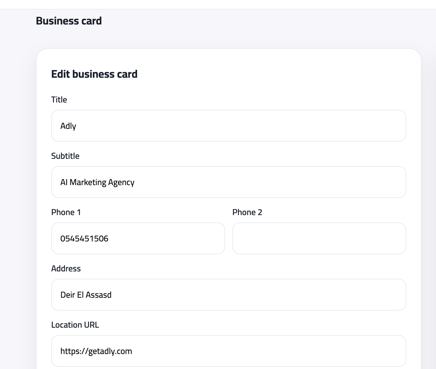 Business card editor form with title, subtitle, phone, address, and location fields